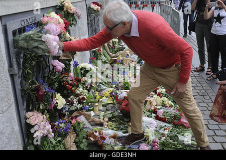 Copenhagen, Denmark. 16th July, 2016.-European union and French flags at half mast at french embassy and people are puring with flowers to pay tribute and stand solidatry with Frnech victims dies in terrorist attacked in Nice France on French national day on july 14, 2016 Credit:  Francis Joseph Dean/Dean Pictures/Alamy Live News Stock Photo