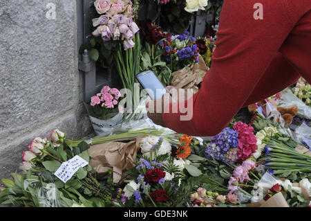 Copenhagen, Denmark. 16th July, 2016.-European union and French flags at half mast at french embassy and people are puring with flowers to pay tribute and stand solidatry with Frnech victims dies in terrorist attacked in Nice France on French national day on july 14, 2016 Credit:  Francis Joseph Dean/Dean Pictures/Alamy Live News Stock Photo