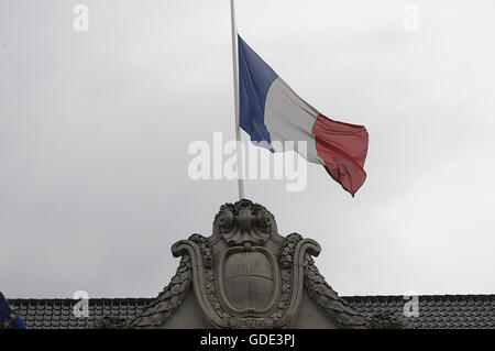 Copenhagen, Denmark. 16th July, 2016.-European union and French flags at half mast at french embassy and people are puring with flowers to pay tribute and stand solidatry with Frnech victims dies in terrorist attacked in Nice France on French national day on july 14, 2016 Credit:  Francis Joseph Dean/Dean Pictures/Alamy Live News Stock Photo