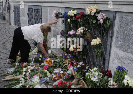 Copenhagen, Denmark. 16th July, 2016.-European union and French flags at half mast at french embassy and people are puring with flowers to pay tribute and stand solidatry with Frnech victims dies in terrorist attacked in Nice France on French national day on july 14, 2016 Credit:  Francis Joseph Dean/Dean Pictures/Alamy Live News Stock Photo