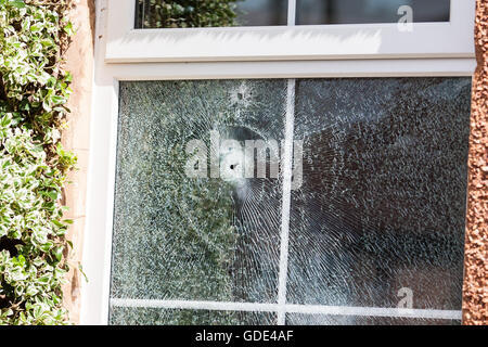 Belfast, UK, Europe. 16th July 2016. Two bullet holes in the double glazed window after a Gun Attack at on House in West Belfast Credit:  Bonzo/Alamy Live News Stock Photo