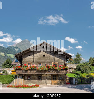 Matrei in Osttirol,Austria,Ancient wooden farmhouses with flower tubs at the Pattergasse Stock Photo