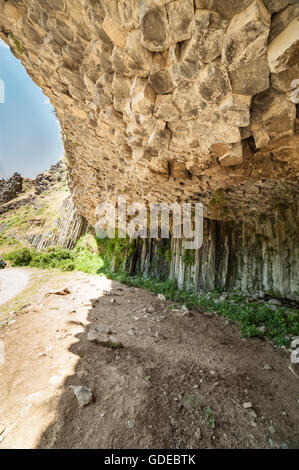 Cave made of giant basalt pillars in Garni gorge, Armenia Stock Photo
