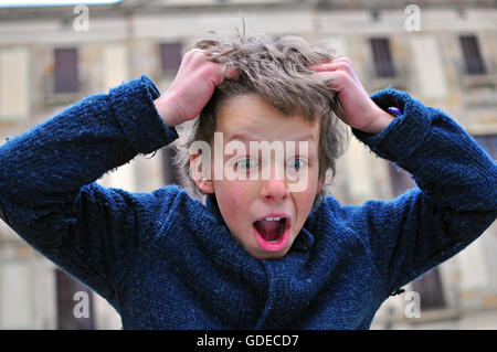 Surprised boy with a wide eyes Stock Photo