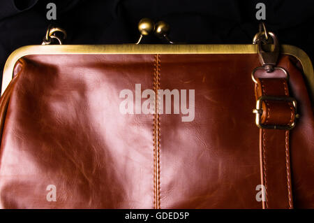 closeup of the fittings on the brown leather hand bag Stock Photo