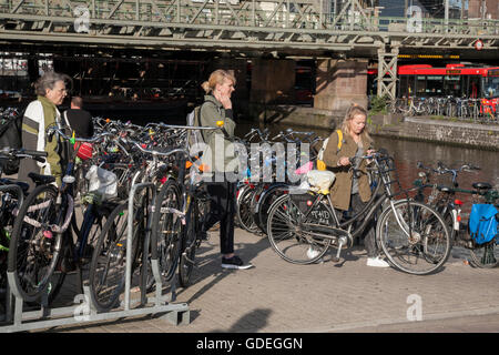 Cyclist outside Ceentral - Central Railway Station; Amsterdam; Holland; Stock Photo