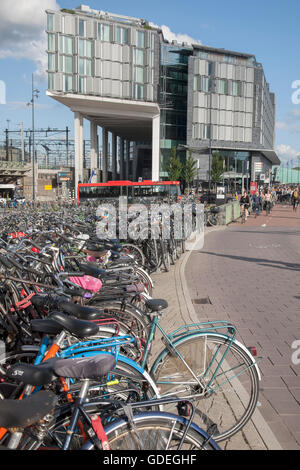 Bikes outside Ceentral - Central Railway Station, Amsterdam; Holland Stock Photo