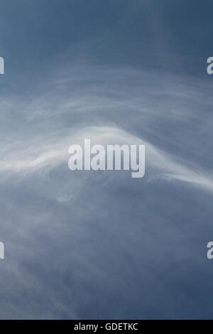 white light whispy clouds in blue sky Stock Photo