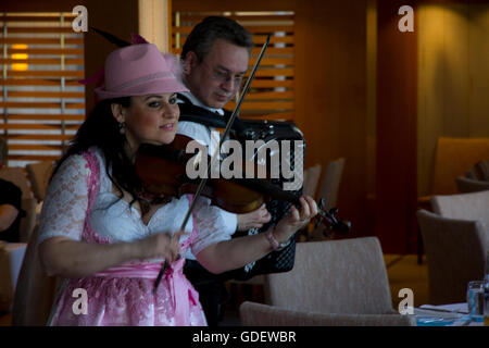 Local German entertainers perform during the "Taste of Germany" buffet dinner onboard Viking Alruna during a recent Rhine cruise Stock Photo