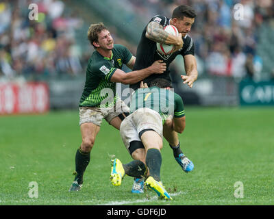 Sonny Bill Williams of New Zealand gets tackled by South Africa players Kwagga Smith and Ryan Kankowski. Stock Photo