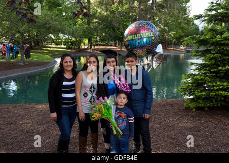 university student attending graduation ceremony at Sonoma State University in Rohnert Park in Sonoma County in California United States Stock Photo