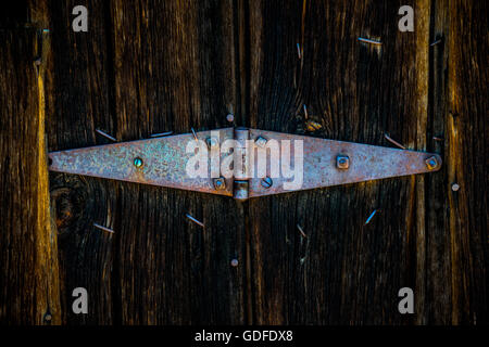 Old Rustic Hinge on Wooden Barn Doors Stock Photo