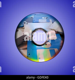 Dvd or cd and old floppy disk inside Stock Photo