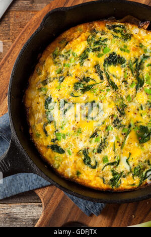 Homemade Spinach and Feta Fritatta in a Skillet Stock Photo