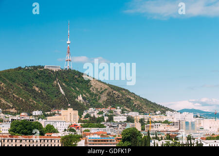 The Mtatsminda Mount Is Holy Mountain In Tbilisi, Georgia. On Top Of The Mountain Is 277.4 M Tall Tower, A Park With A Funicular Stock Photo