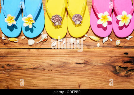 colorful flip-flops on the wooden board Stock Photo