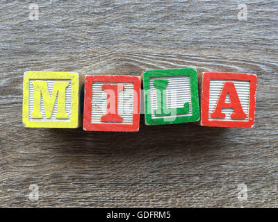 Mila name written with wood block letter toys Stock Photo