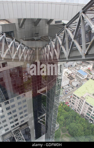 Two elevated escalators connecting the two 40-story towers of Umeda Sky Building in Osaka. Stock Photo