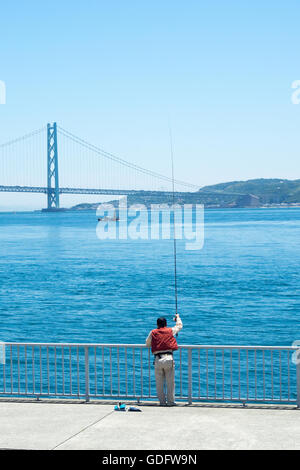 The Akashi Kaikyō Bridge connecting Kobe on Honshu Island to Iwaya on Awaji Island. Stock Photo