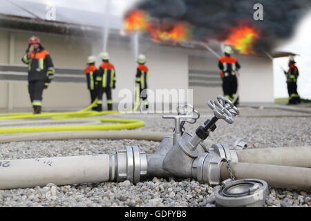 Firefighters solar roof panels photovoltaic on fire Stock Photo