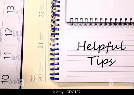 Helpful tips text concept write on notebook Stock Photo