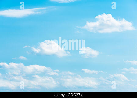 Clear blue sky with white fluffy clouds Stock Photo