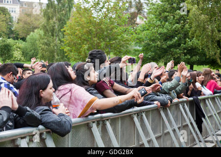 An enthusiastic audience of mostly young Punjabi-Scots young adults enjoys a performance at the O2 Glasgow Mela. Stock Photo