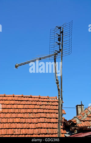 Old television antenna to receive signals from the transmitter. Stock Photo