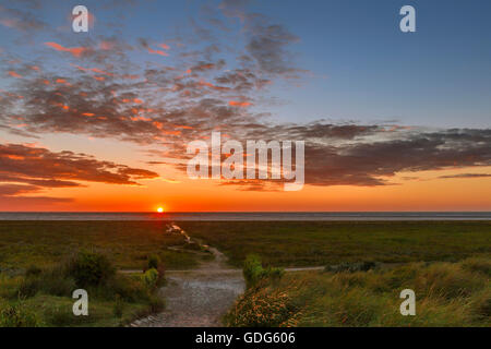 A Fiery Sunset On The Beach Of Schiermonnikoog, One Of The West Frisian ...