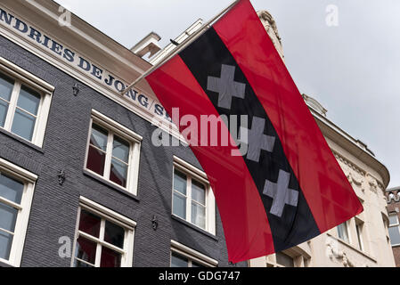 Amsterdam City flag with three crosses flying outside a building
