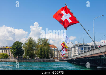 Flags on the Pont du Mont Blanc as it spans Lake Geneva Stock Photo