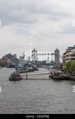 View from London Bridge along River Thames, looking towards Tower Bridge and including HMS Belfast Stock Photo