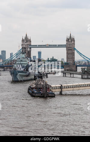 View from London Bridge along River Thames, looking towards Tower Bridge and including HMS Belfast Stock Photo