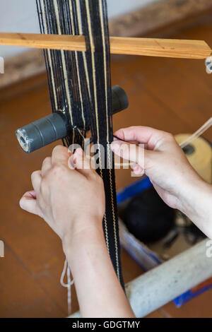 Details of weaving oriental rugs. Stock Photo