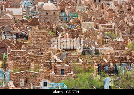 Old and new graves are side by side in the ancient city of Nukus in Uzbekistan. Stock Photo