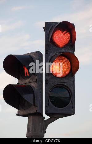 Iceland: a traffic light with red heart shaped in the city of Akureyri, the city of the midnight sun, the capital of the north Stock Photo