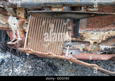 Close up detail of radiator and engine bay of burnt out car Stock Photo