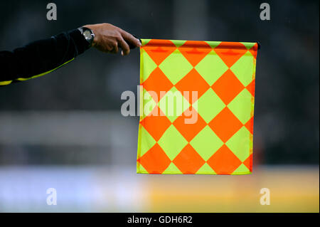 Flag of the assistant referee indicating offside, qualifier for the UEFA European Football Championship 2012 Stock Photo