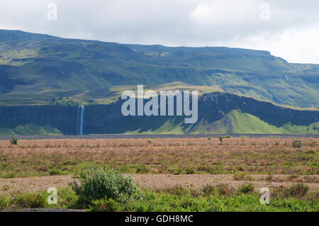 Iceland: the area of Seljalandsfoss waterfall, part of river Seljalands which origins in the volcano glacier Eyjafjallajokull Stock Photo