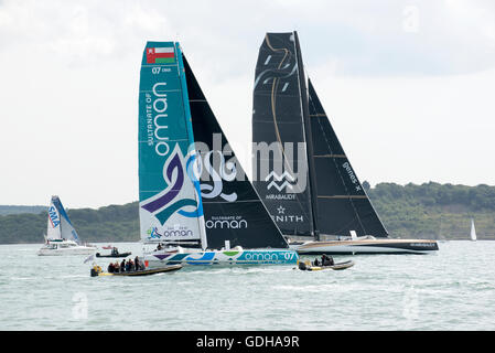 RACING YACHTS OF ISLE OF WIGHT UK AUGUST 2015 - Racing yachts undersail on The Solent with spectator boats in attendance Stock Photo