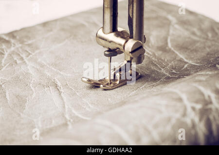 Sewing machine needle with leather Stock Photo