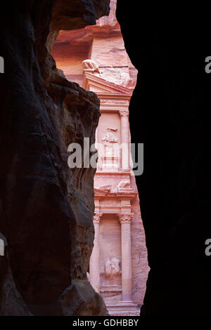 Glimpse to the Treasury (Al Khazneh), a Nabatean masterpiece inside the archaeological site of Petra, Jordan.