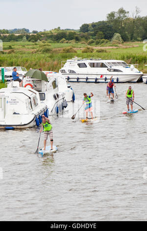 Novice paddle boarders Stock Photo - Alamy