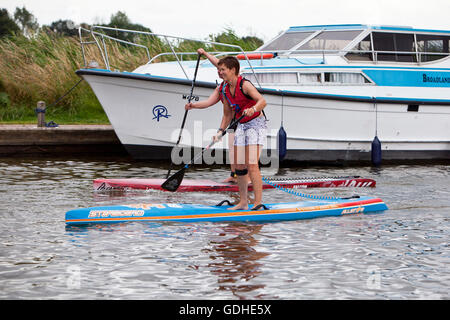 Novice paddle boarders Stock Photo - Alamy