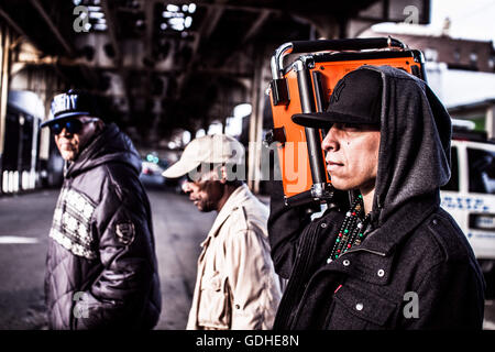 New York, New York, USA. 31st Mar, 2016. Rapper Adrian walks with his boombox around Bronx. He usually raps to an instrumental music that goes out from a boombox. NY This series is about the real rap scene in US and a daily life of the local rappers (MCs, DJs, Bboys, graffiti makers etc.). About their highlights and the other parts of their lives. About the real face of it as a proove that this culture still exists at non commercial level. © David Tesinsky/ZUMA Wire/Alamy Live News Stock Photo