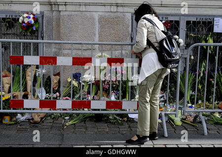 Copenhagen, Denmark. 17th July, 2016. European Union and French flags at half-mast at the French Embassy.  People pay tribute to the terrorist victims in Nice, France with flowers. Credit:  Francis Joseph Dean/Dean Pictures/Alamy Live News Stock Photo