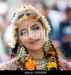 London, UK. 17 July 2016.  A girl dressed as Lord Krishna's consort.  Devotees celebrate the annual Rathayatra festival ('cart festival'), in central London.  Hare Krishna followers towed three huge decorated carts from Hyde Park corner to Trafalgar Square, singing and dancing all the way. Credit:  Stephen Chung / Alamy Live News Stock Photo
