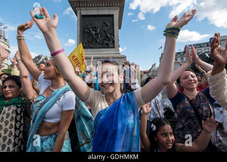 London, UK. 17 July 2016.  Devotees dance to the final 'kirtan' (song) being played as they celebrate the annual Rathayatra festival ('cart festival'), in central London.  Hare Krishna followers towed three huge decorated carts from Hyde Park corner to Trafalgar Square, singing and dancing all the way. Credit:  Stephen Chung / Alamy Live News Stock Photo