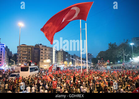 Istanbul, Turkey. 17th July, 2016. People shout slogans and hold flags during a demonstration at Taksim Square in Istanbul, Turkey, 17 July 2016. Turkish authorities state they have regained control of the country after thwarting a coup attempt. Photo: Marius Becker/dpa/Alamy Live News Stock Photo