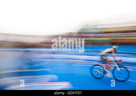 Hamburg, Germany. 16th July, 2016. An athlete cycling in the 7th station of the men's triathlon at the World Triathlon Series in Hamburg, Germany, 16 July 2016. Photo: LUKAS SCHULZE/dpa/Alamy Live News Stock Photo